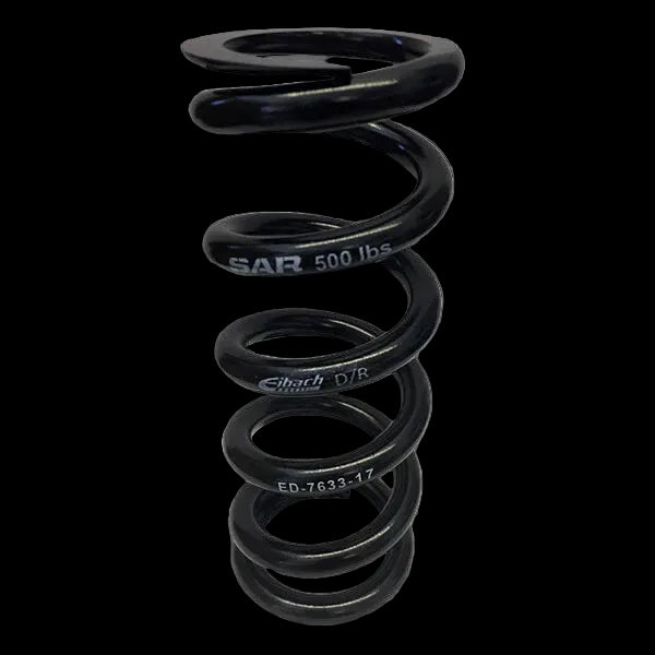 A black coiled steel spring with the text 'SAR 500 lb' and 'ED.76237.17' printed on it, indicating its specifications.